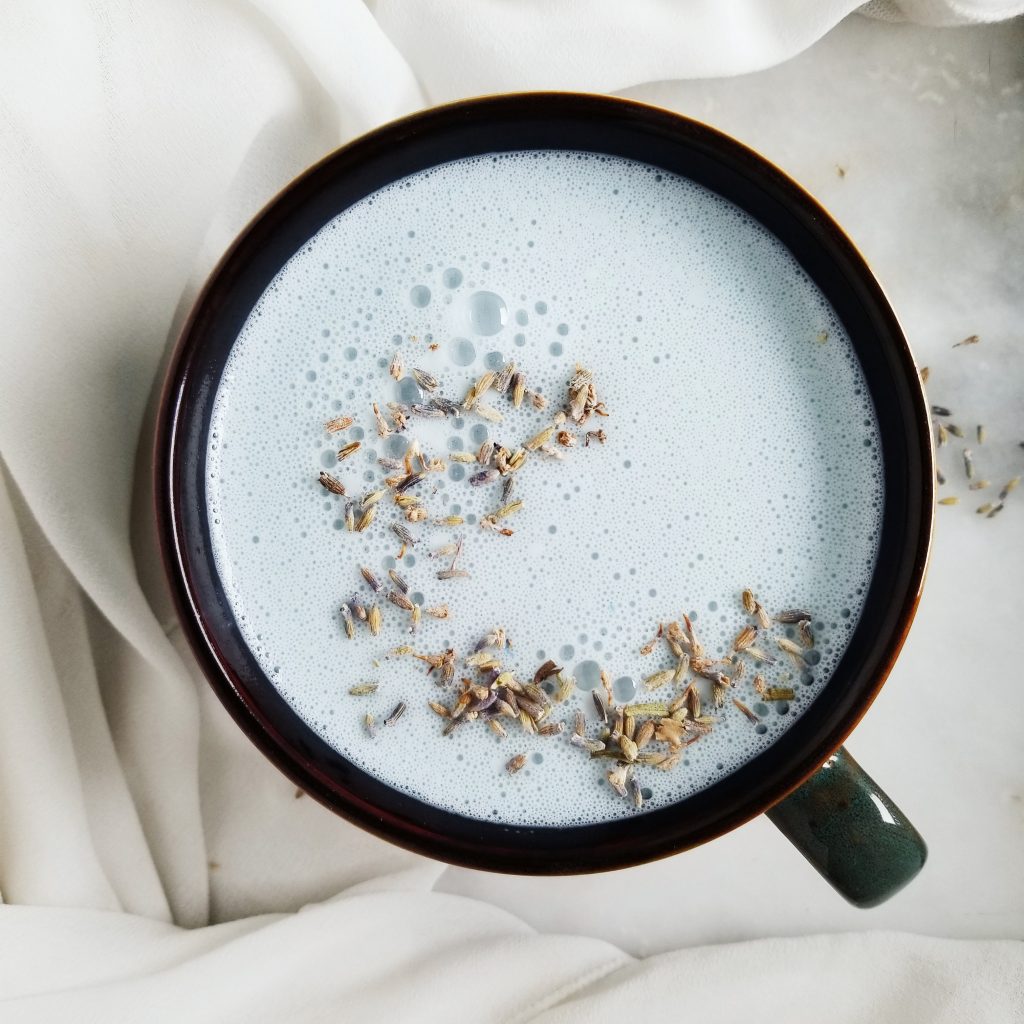 blue spirulina latte with dried lavender on top 