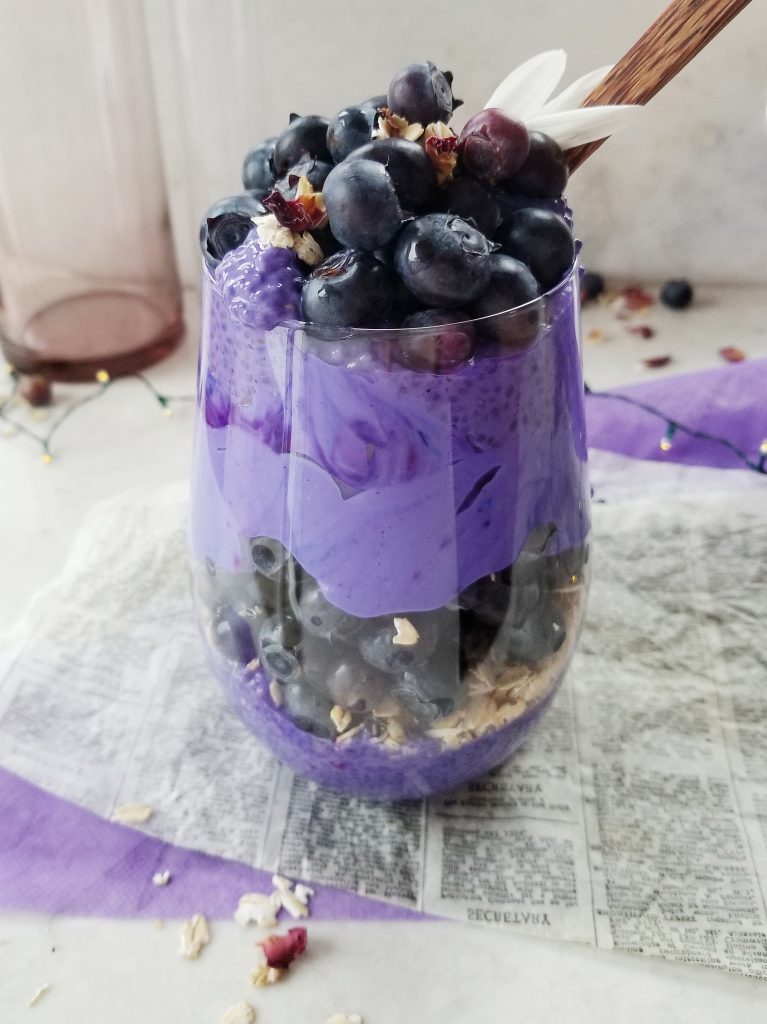 Blueberry chia seed pudding layered in a jar with yogurt
