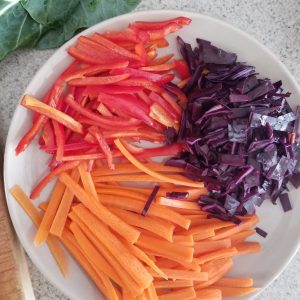 sliced carrots, peppers, and cabbage for the collard green wraps