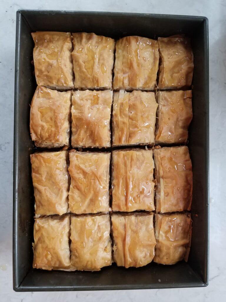 what the baklava should look like after pouring the honey mixture over it 