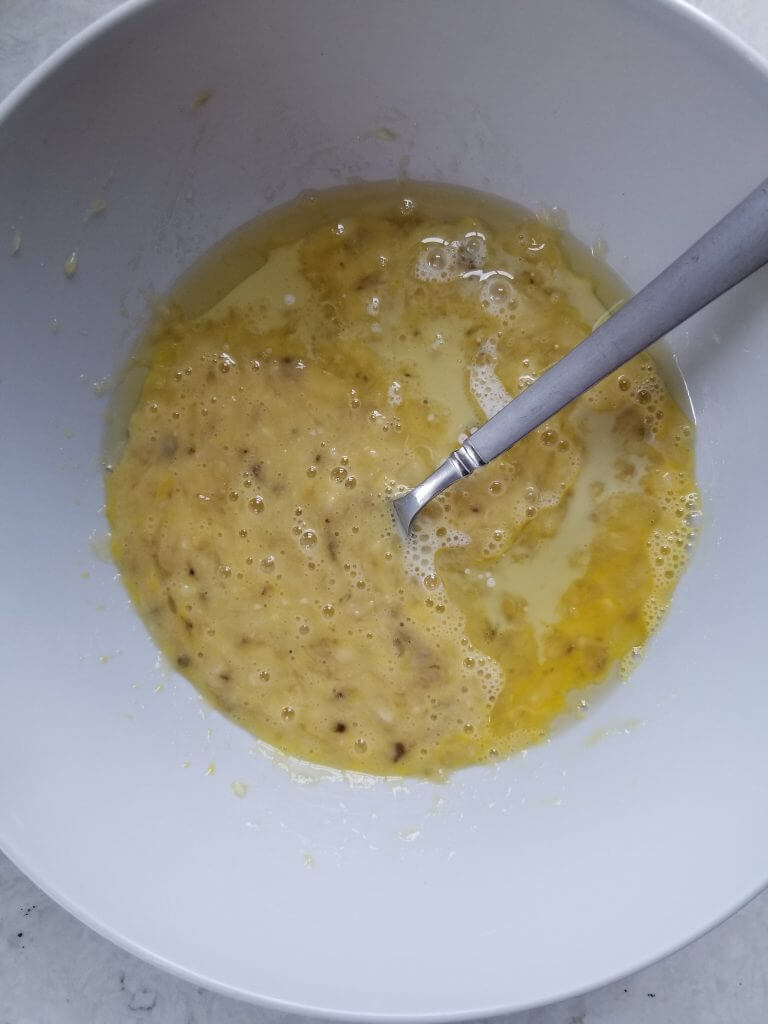 a separate bowl with the wet ingredients that are going to be used in the banana oat muffins