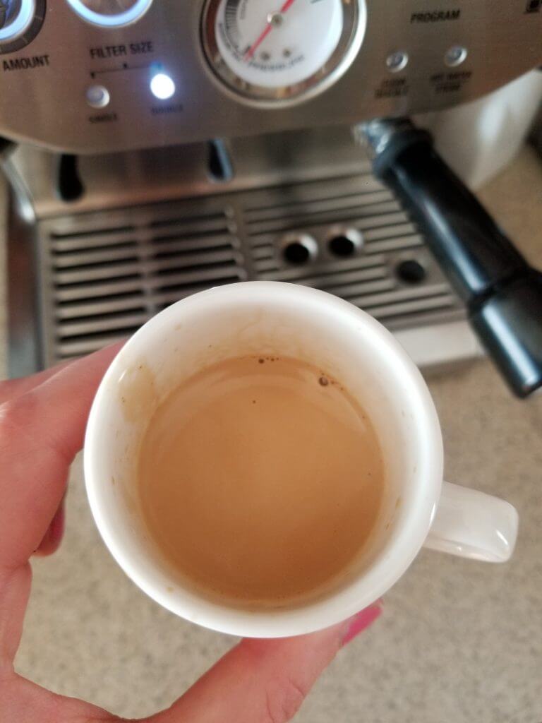 espresso shot close up to show the foam on top of the espresso