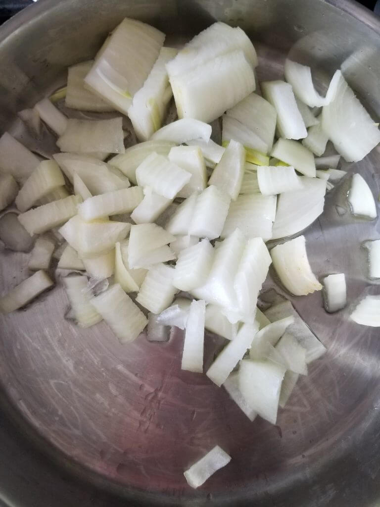 Diced onions in the pan with oil