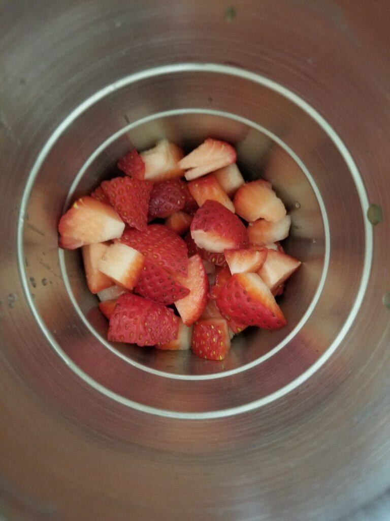 chopped strawberries in the drink mixer
