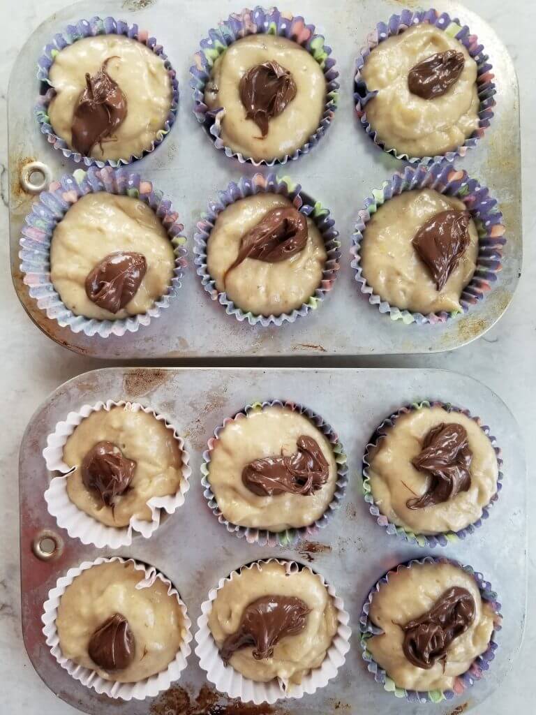 dairy free nutella on banana muffin batter before baking them