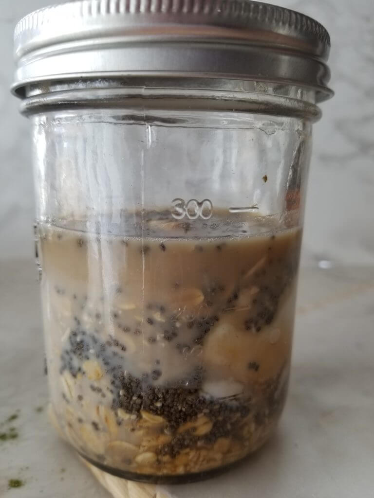 oats, chia seeds, cold brew coffee, milk, and yogurt in a mason jar