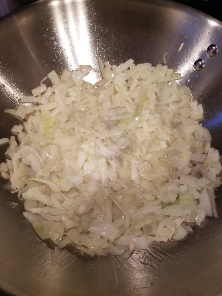 onions in a wok