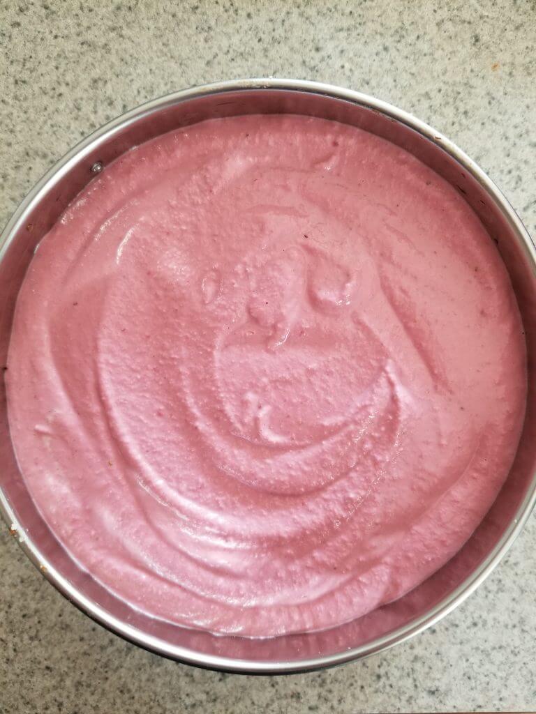 Vegan Strawberry Cashew Cheesecake in a spring form pan before freezing it 