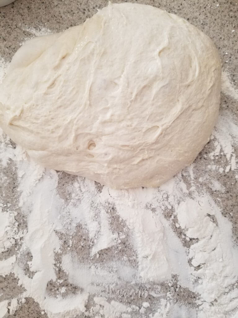 homemade ciabatta bread dough on  a floured counter