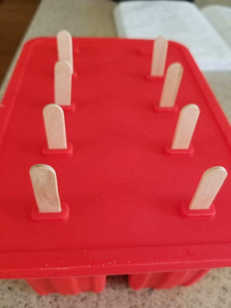 healthy strawberry popsicles in the molds