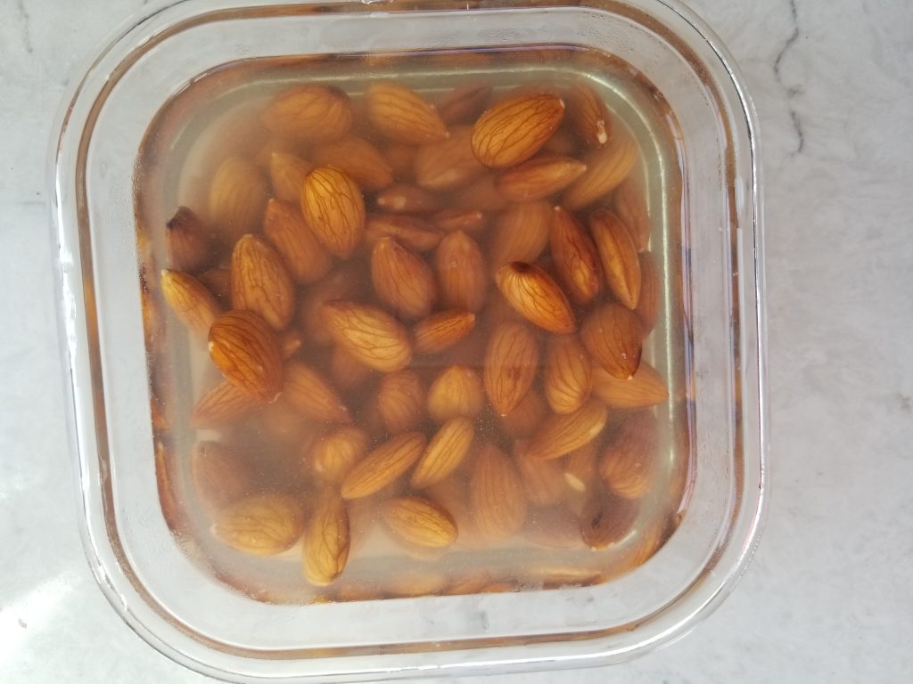 soaked almonds in a glass dish 