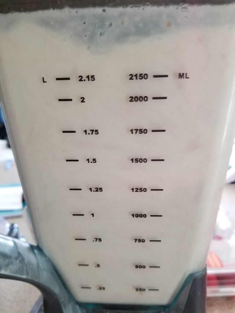 blending the almond milk in a blender