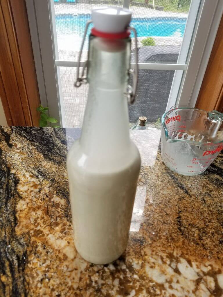 Vanilla almond milk creamer in a swing top milk jar 