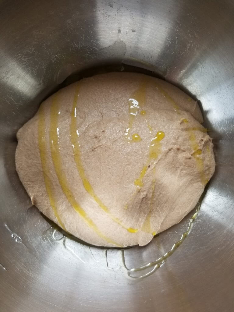 oil on the whole wheat ciabatta bread dough before stretching and folding 