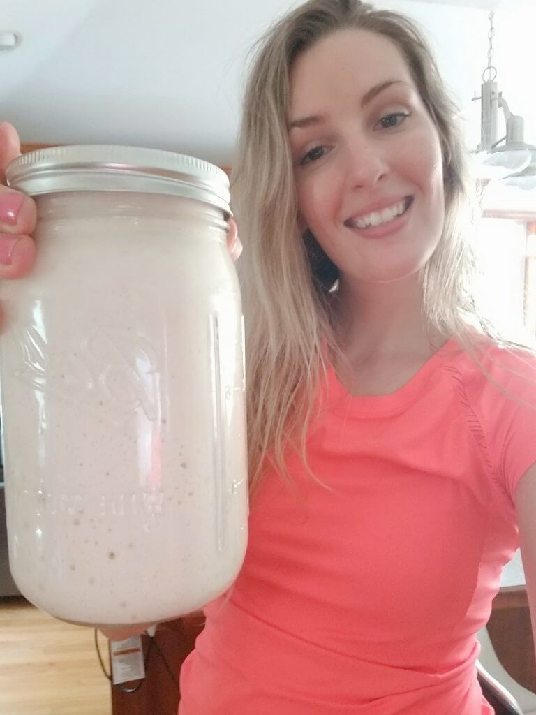thehintofrosemary with a sourdough starter in a mason jar 