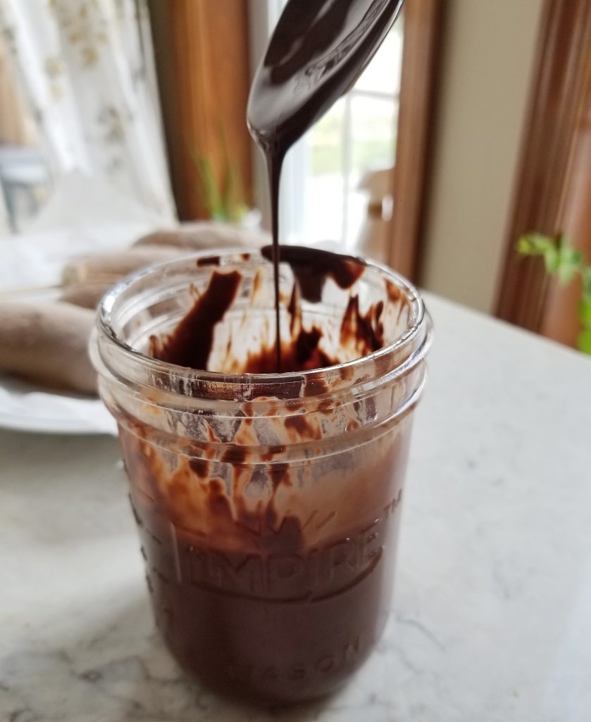 melted dark chocolate in a mason jar 